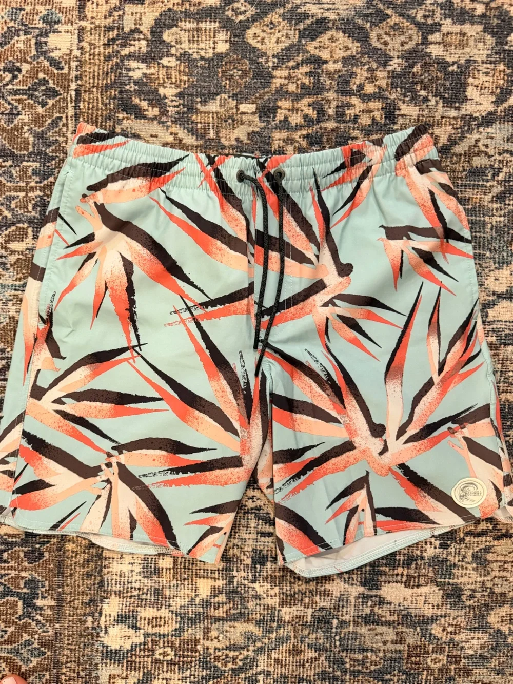 O'Neill Mint Blue Tropical Print Swim Shorts with Coral and Black Accents